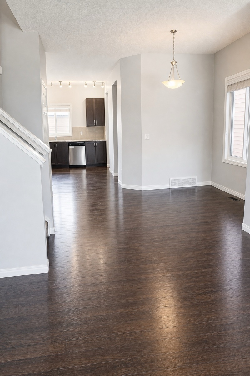 Open-plan main floor with gleaming hardwood after a NeatNow clean
