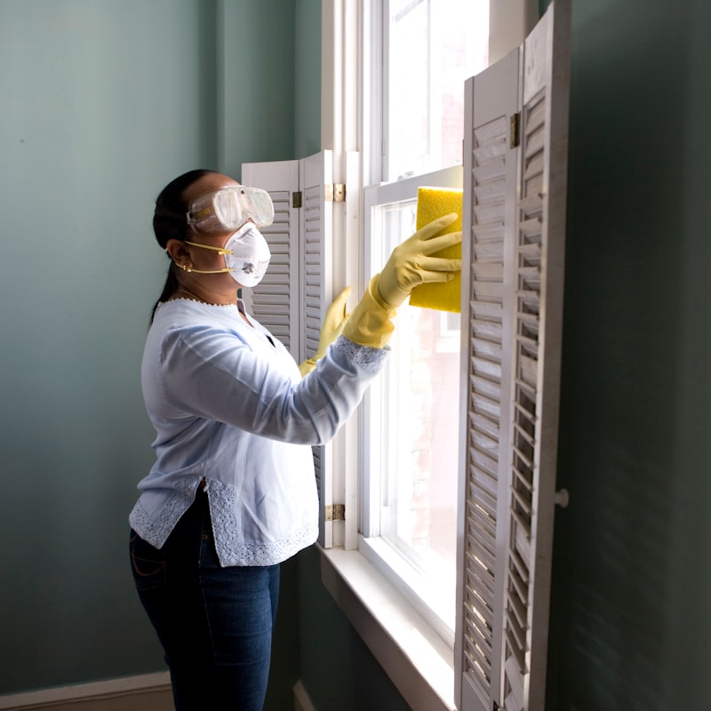 Professional cleaner following a detailed cleaning checklist in a Calgary home