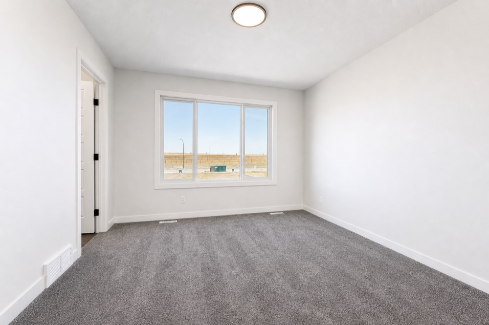Clean, empty bedroom ready for the next tenant after a NeatNow move-out clean in Calgary
